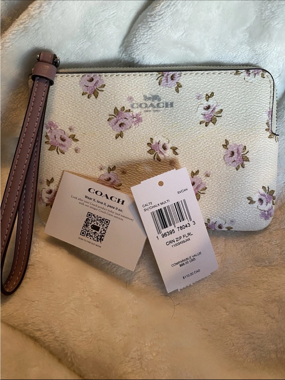 Coach Cream Floral Wristlet with Pink Roses and silver logo; corner zip